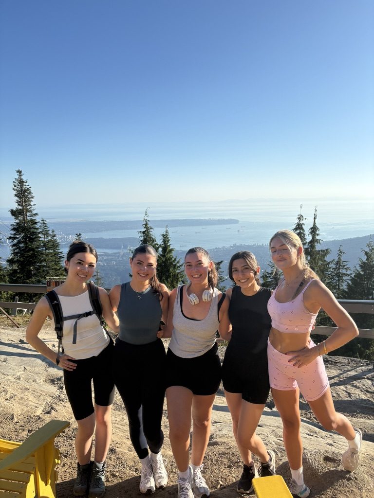 A group at a viewpoint above Vancouver on a clear day